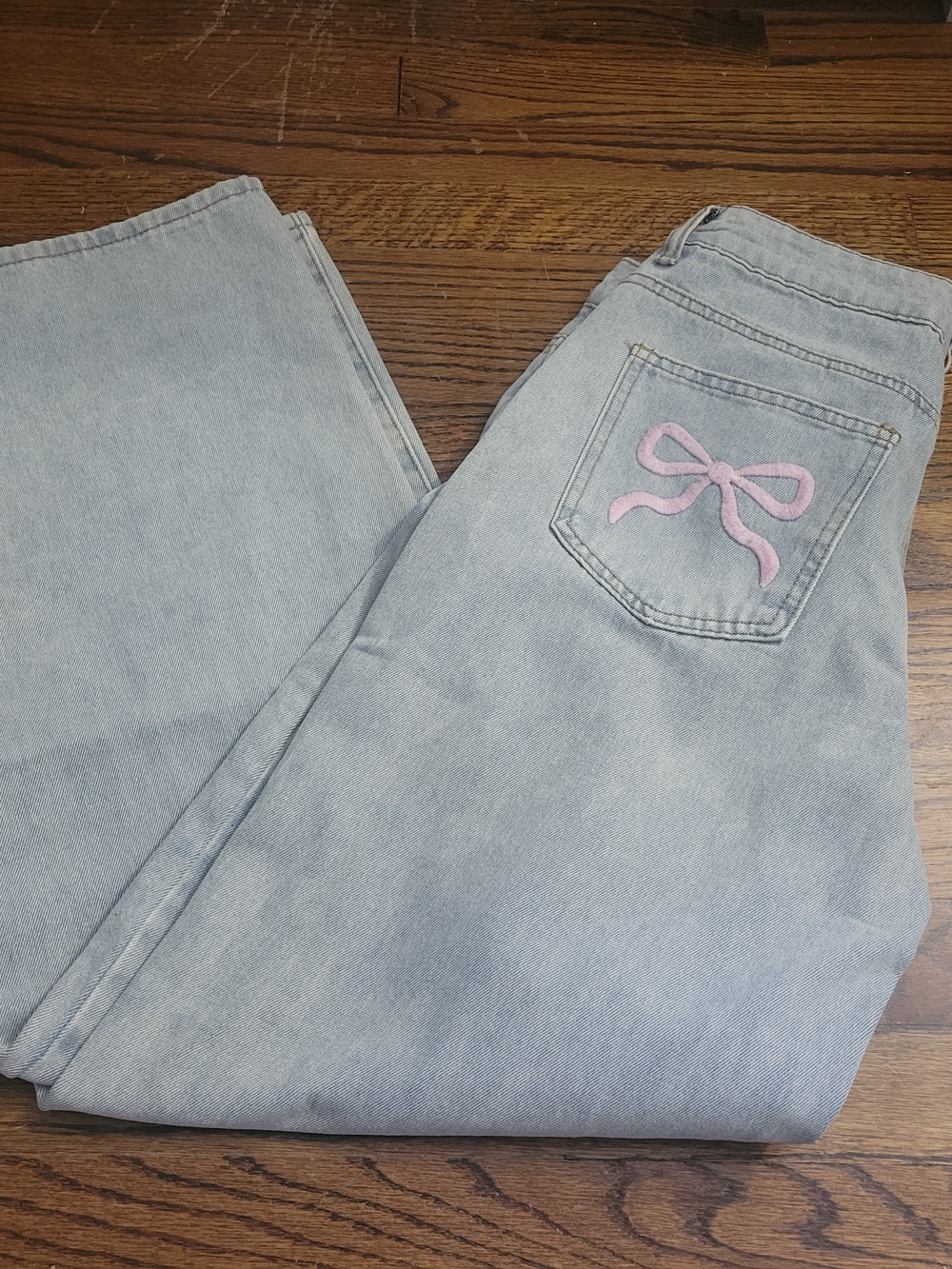 Edikted Light Wash Wide Leg Jeans with Pink Bow Embroidered Pocket